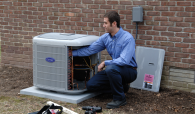Technician performing HVAC maintenance